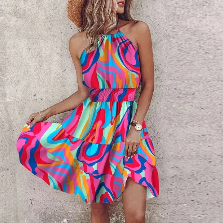 Purple halter neck mini dress featuring a vibrant design.