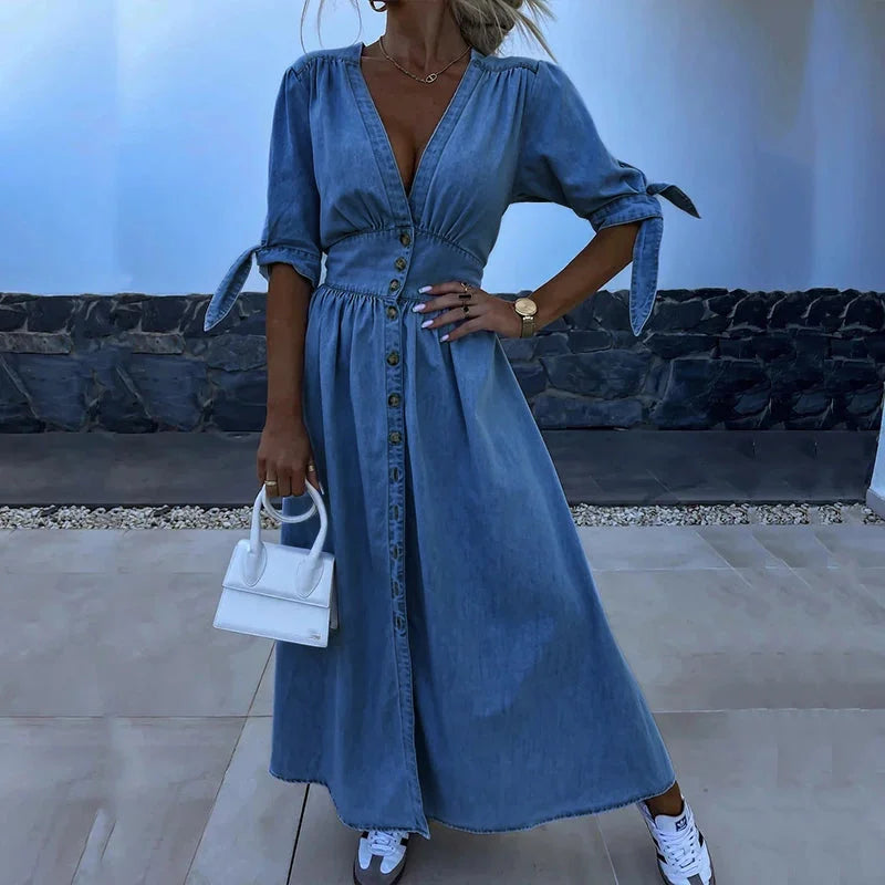 "Denim dress with button-front and tie sleeves, casual and stylish outfit for everyday wear."