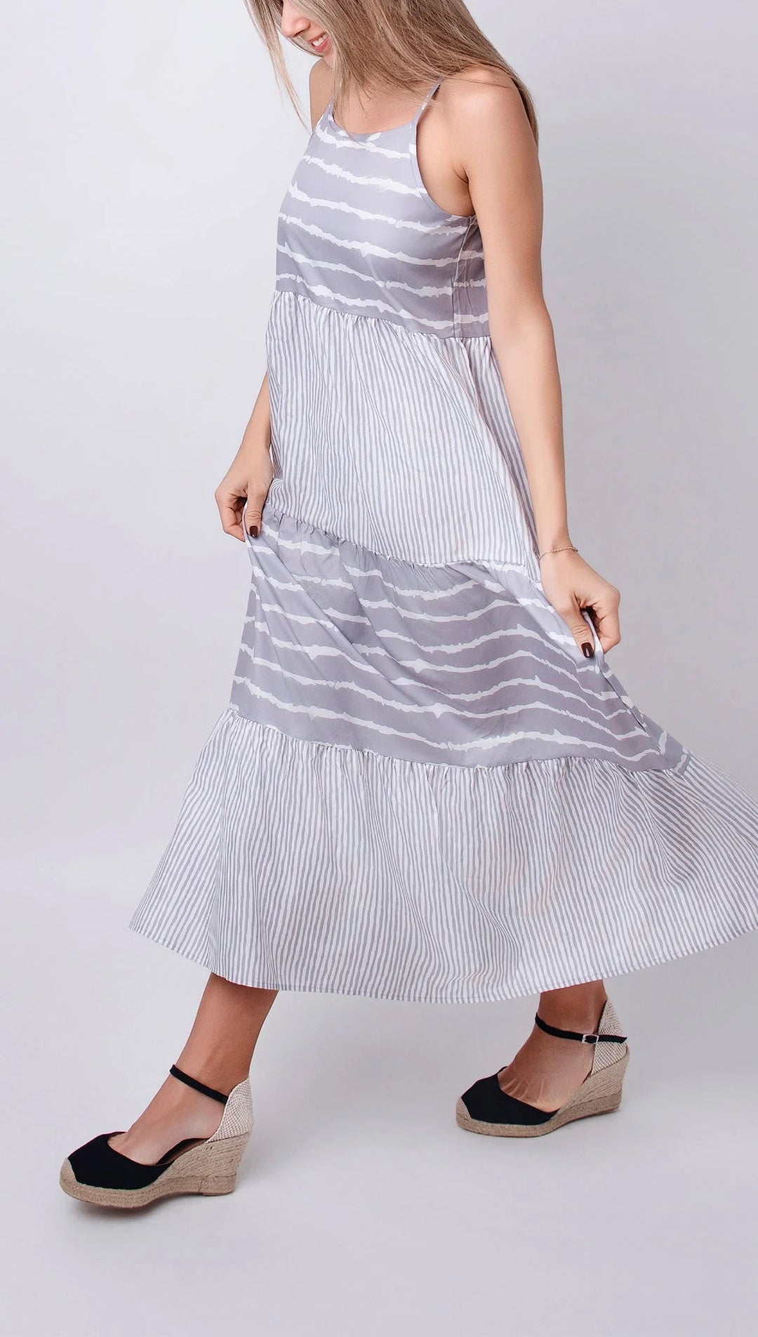 "Sleeveless grey maxi dress in tiers design, made of soft and breathable fabric, perfect for casual occasions or everyday…