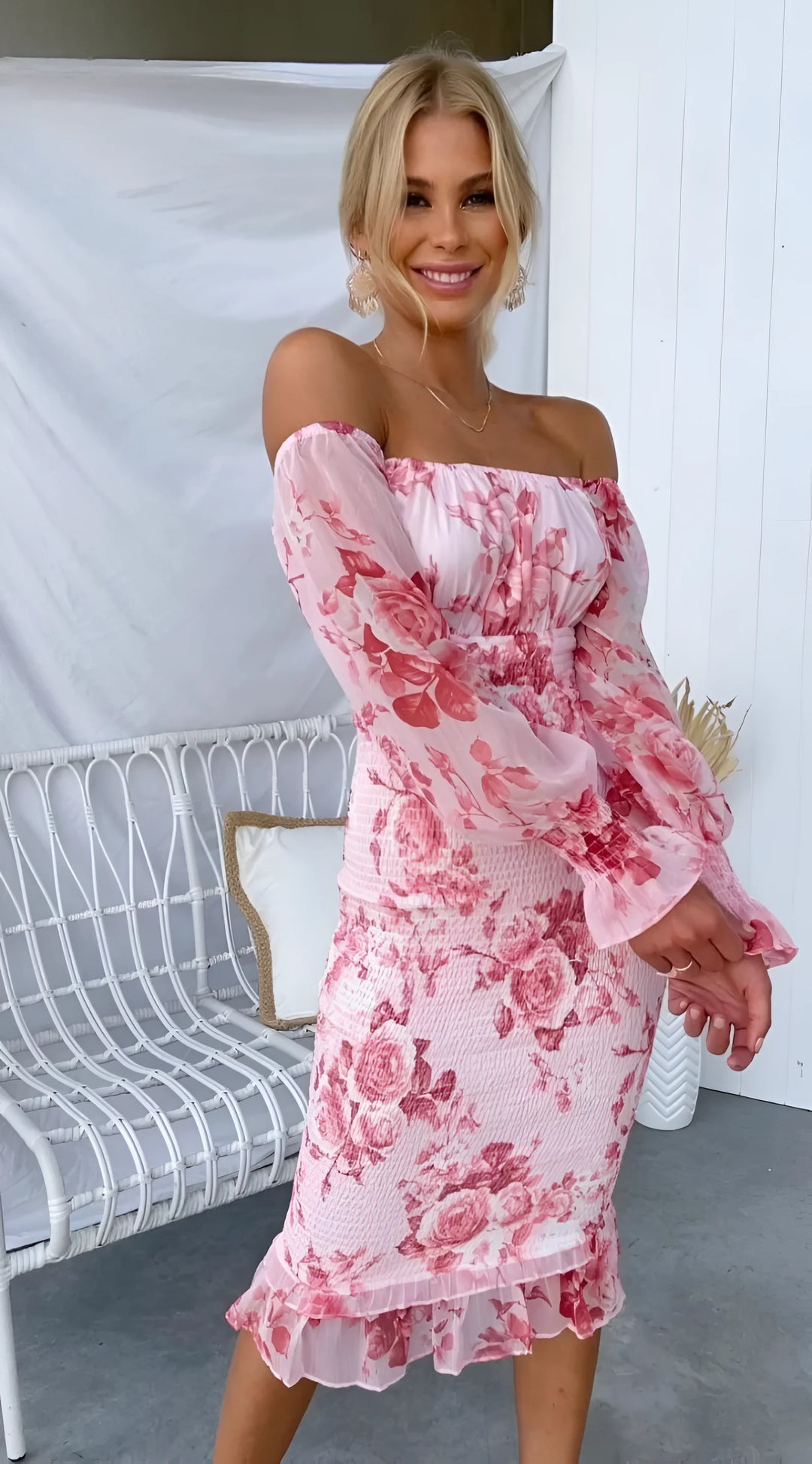 Pink off-shoulder midi dress with ruffles, adorned with floral prints on a soft, flowy fabric - Noemi dress.