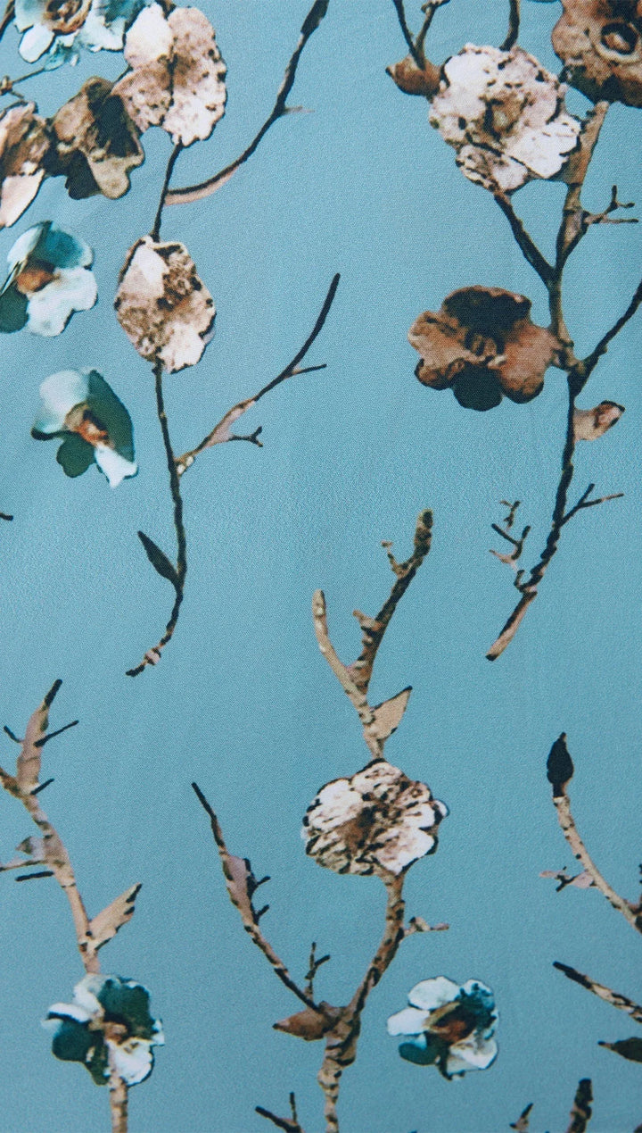 Light blue maxi dress with floral print and half sleeves in a soft, breathable fabric perfect for a casual yet chic look.