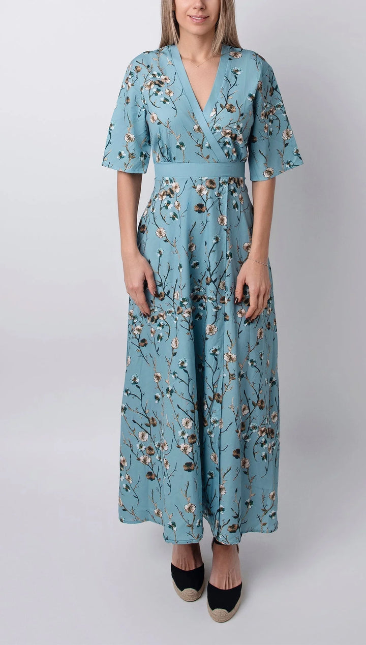 Light blue maxi dress with floral print and half sleeves in soft and flowy fabric, perfect for a casual and chic look.
