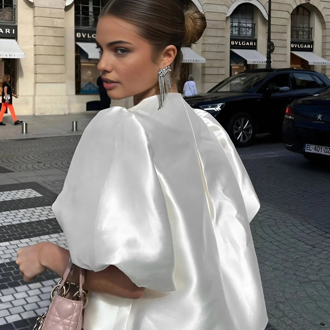 White satin blouse with oversized sleeves for women, stylish and elegant design perfect for everyday wear or special…