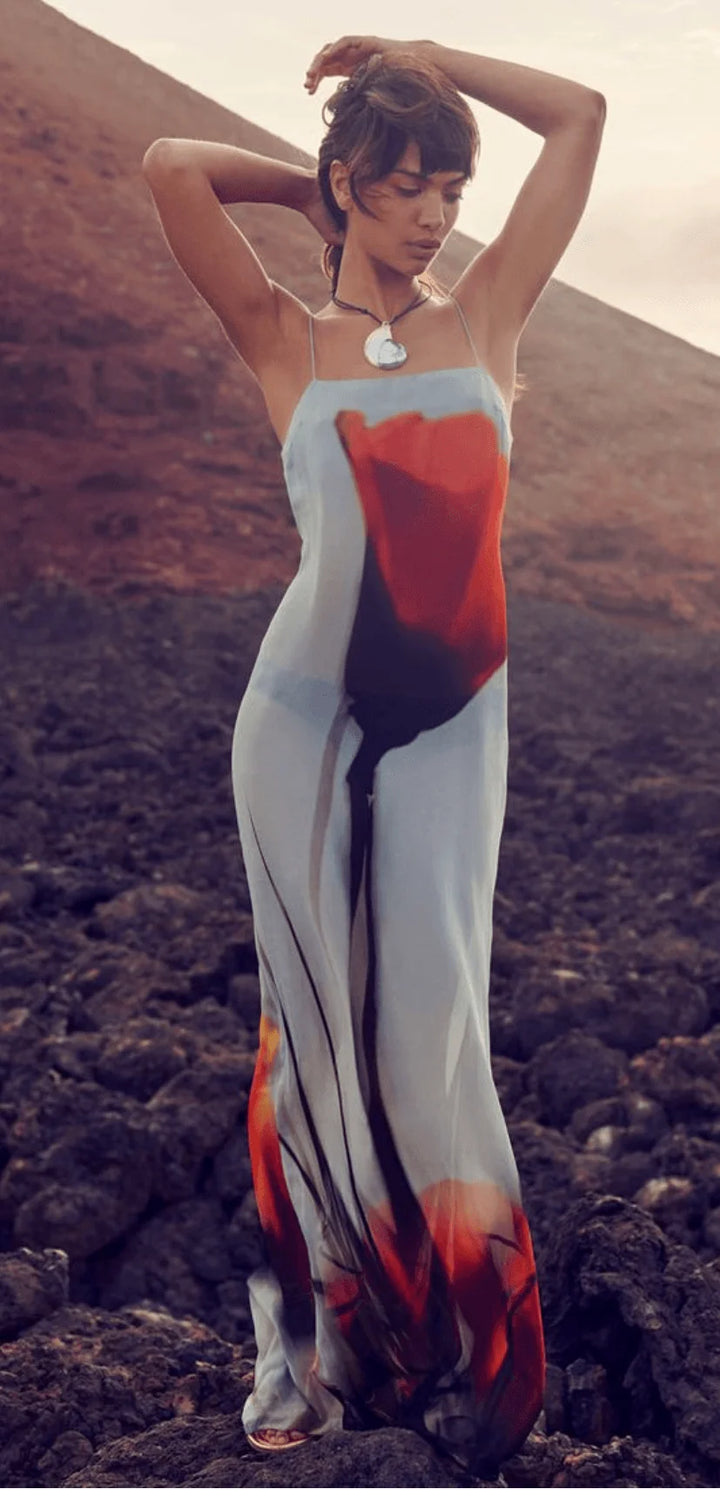 Flowy red and grey abstract maxi dress in a blend of oaklyn fabric, perfect for a casual yet stylish look.