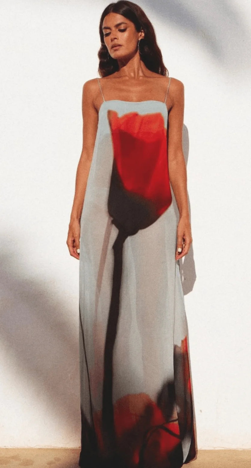 Red and grey abstract maxi dress made of flowy fabric, featuring a unique design that exudes elegance and modern style.