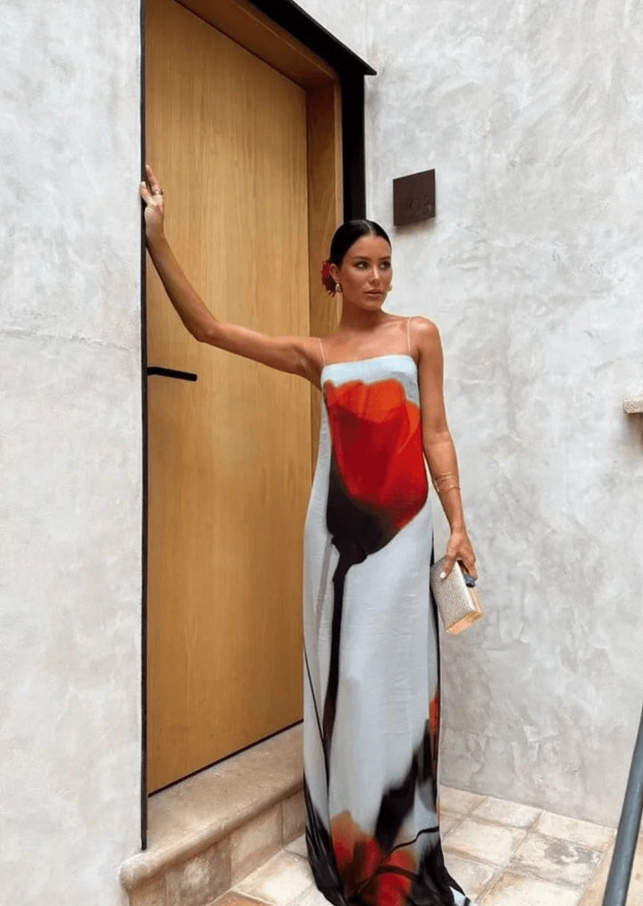 "Red and grey abstract print flowy maxi dress made of comfortable fabric, perfect for casual or dressed-up occasions."