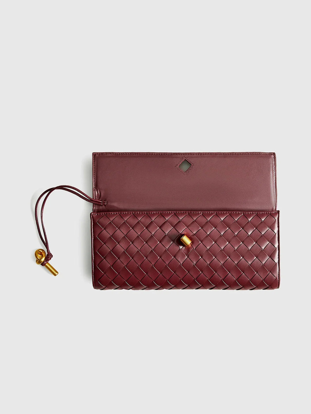 Quilted beige shoulder bag with opal accents and secure clasp closure, perfect for everyday elegance.
