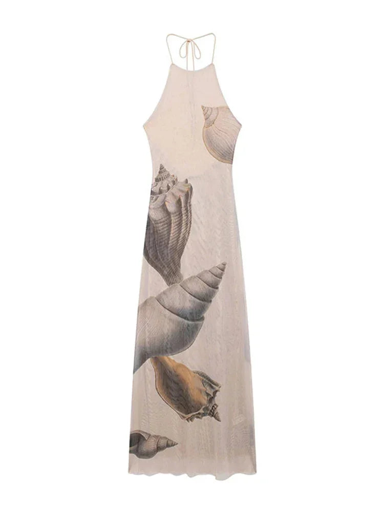 Beige maxi dress with shell print, showcasing elegant design and soft flowing fabric.