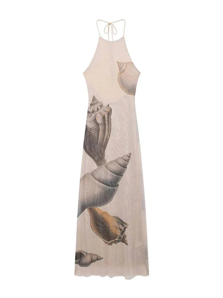 Beige maxi dress with shell print, showcasing elegant design and soft flowing fabric.