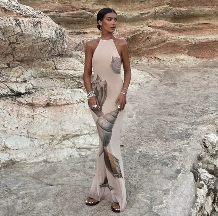 Beige maxi dress with shell print, featuring an elegant and sophisticated design, perfect for a casual chic look.