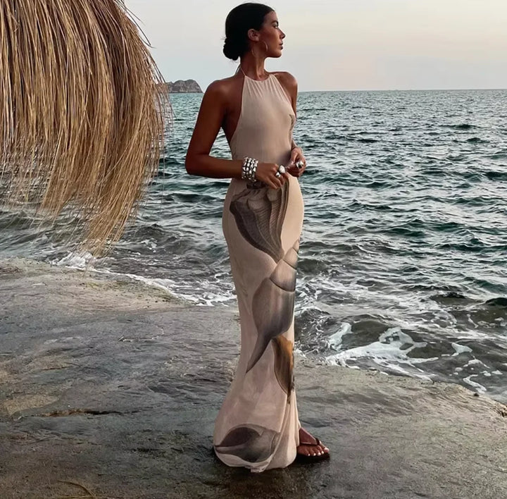 Beige maxi dress with shell print, featuring an elegant design. Crafted from premium quality material, perfect for a stylish…