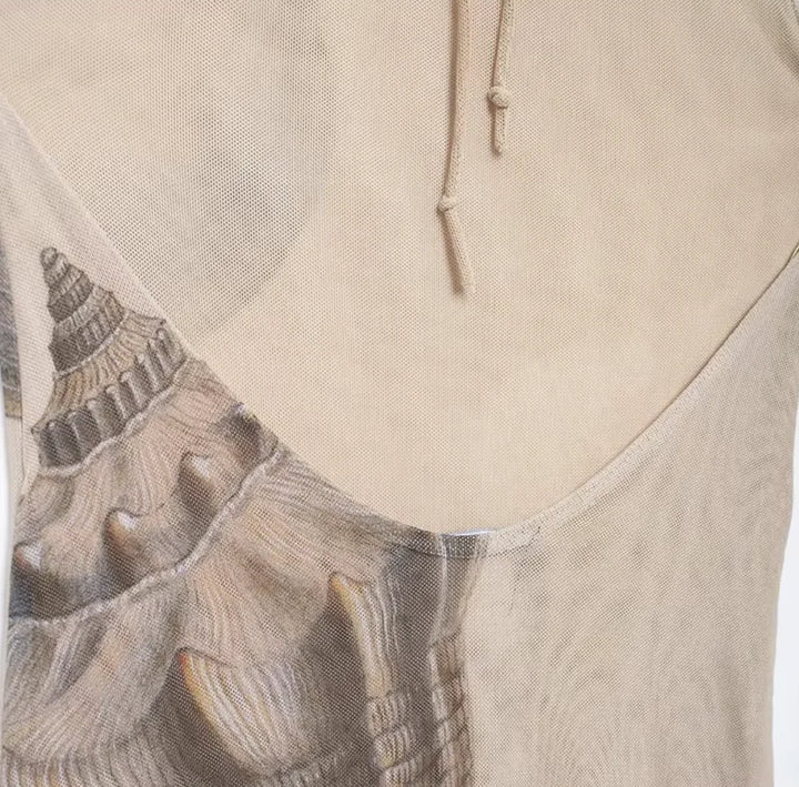 Beige maxi dress with shell print, perfect for summer. Features sleek design and lightweight, breathable fabric.