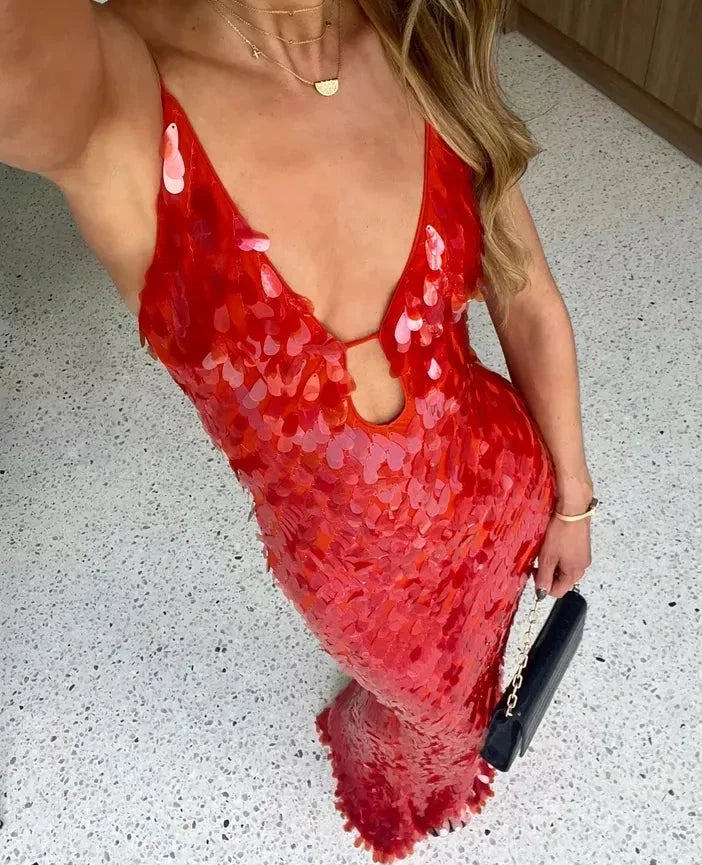 Red sequin maxi dress with deep neckline, perfect for an elegant evening. Made of shimmering sequin fabric, chic and…