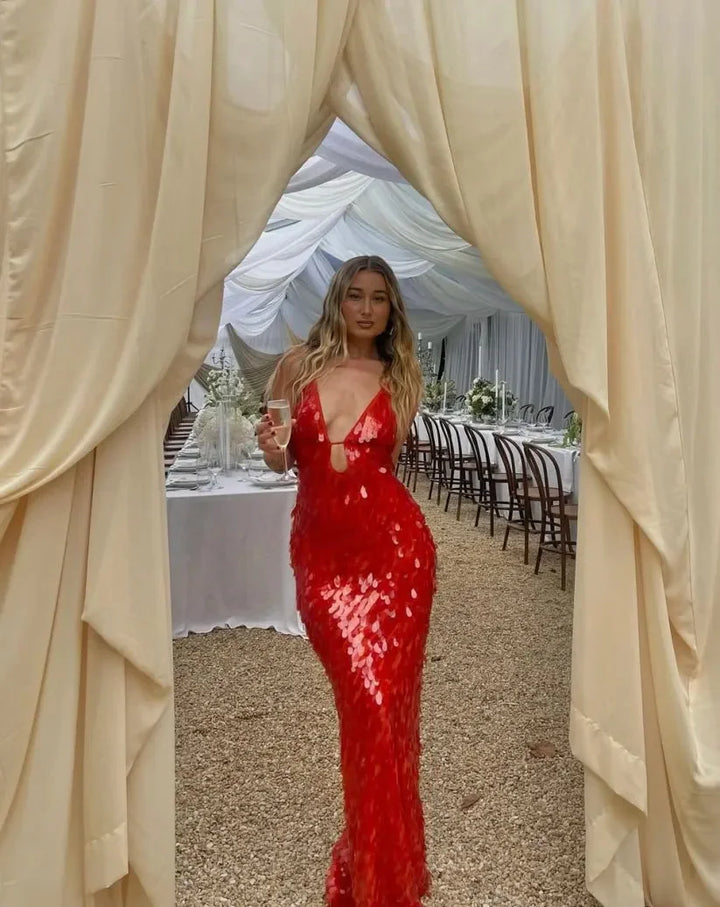Red sequin maxi dress with a deep neckline, perfect for special occasions. Made from sequin fabric that sparkles under the…