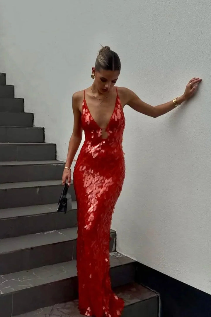 Red sequin maxi dress with a deep neckline, perfect for standing out at any event.