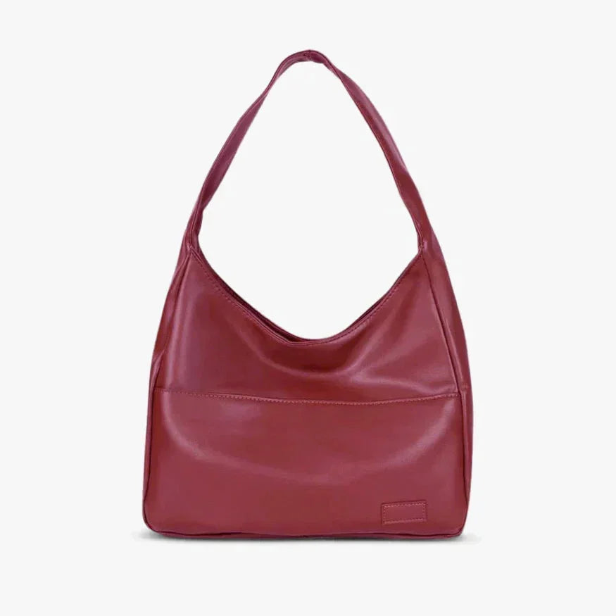 Wine red shoulder bag with modern design and sleek finish perfect for everyday use.