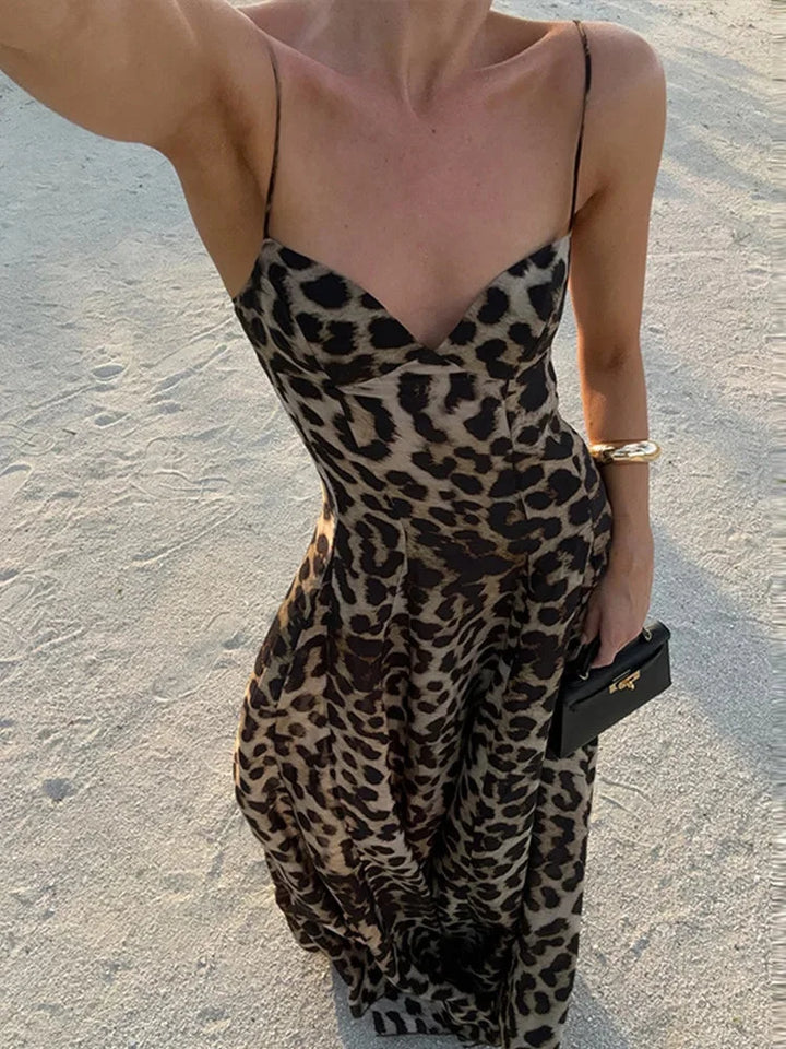 Sleeveless leopard print maxi dress in soft fabric with V-neck cut and flowy silhouette for a chic and trendy look.