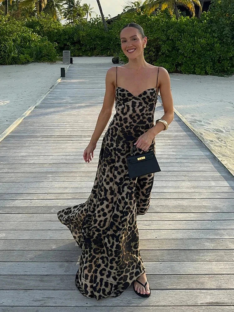 Sleeveless leopard print maxi dress in comfortable polyester blend fabric, perfect for effortlessly chic everyday style.