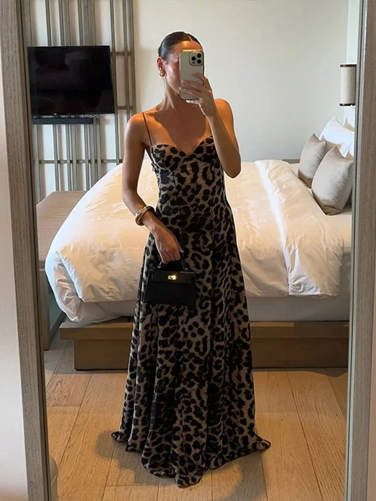 Sleeveless leopard print maxi dress in soft, flowy fabric with stylish round neck and relaxed fit, perfect for casual…
