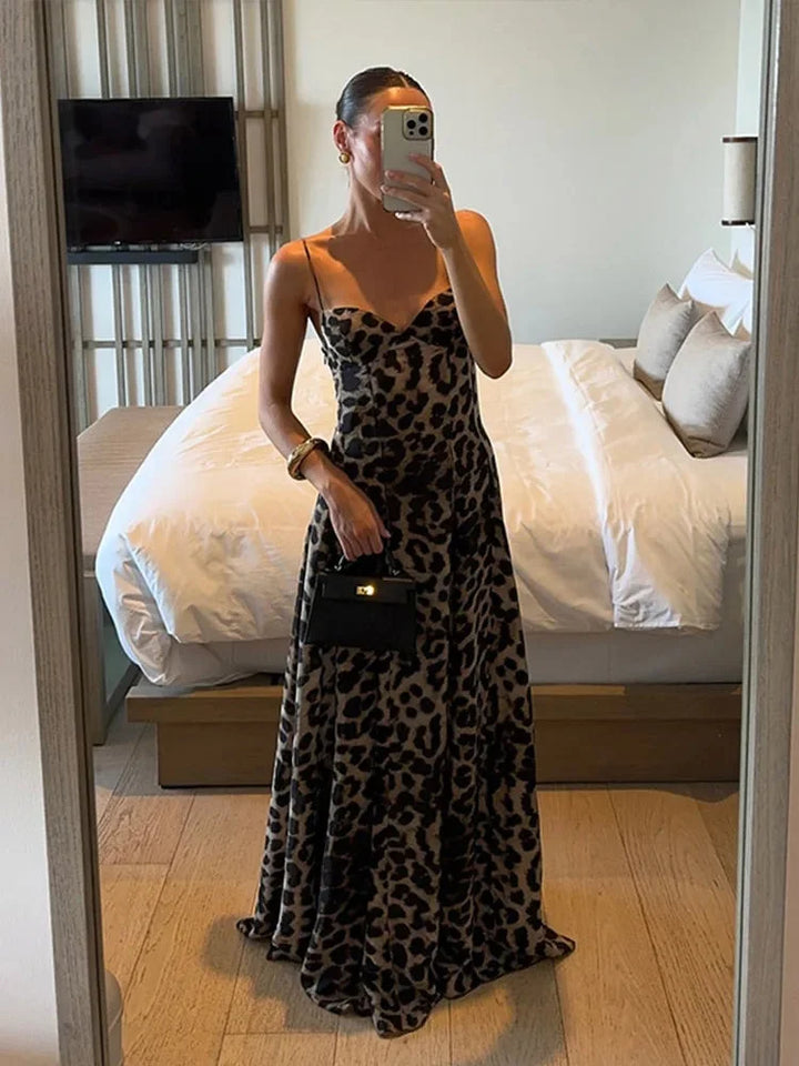 Sleeveless leopard print maxi dress in soft, flowy fabric with stylish round neck and relaxed fit, perfect for casual…