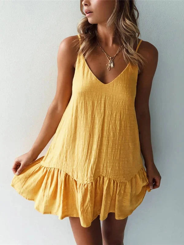 Yellow V-neck dress with ruffled details by Quetzali. Made of light, flowy fabric perfect for summer outings.