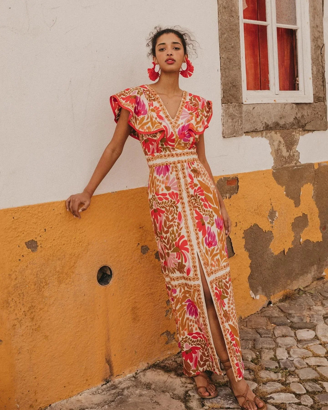 Red floral slit maxi dress for women by Quetzalli, featuring a lightweight fabric with a vibrant floral print and a stylish…