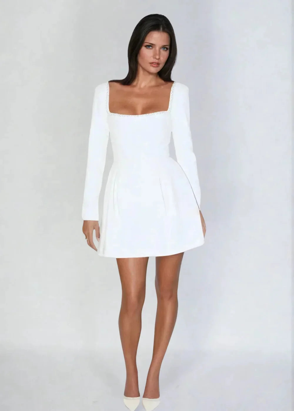White mini dress with square neck and bead detail, perfect for a chic and stylish look.