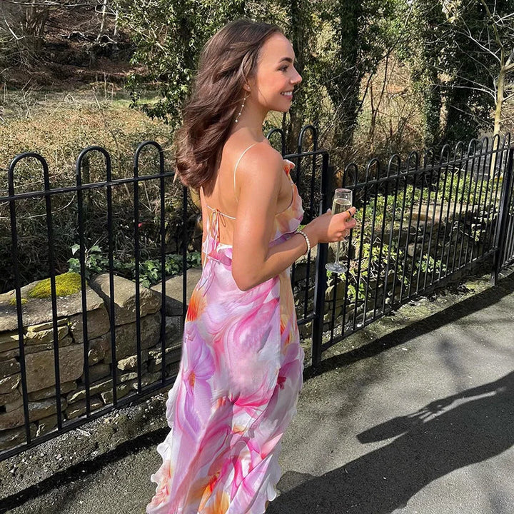 Sleeveless floral maxi dress by Rihanna with ruffle trim, a perfect blend of elegance and style.