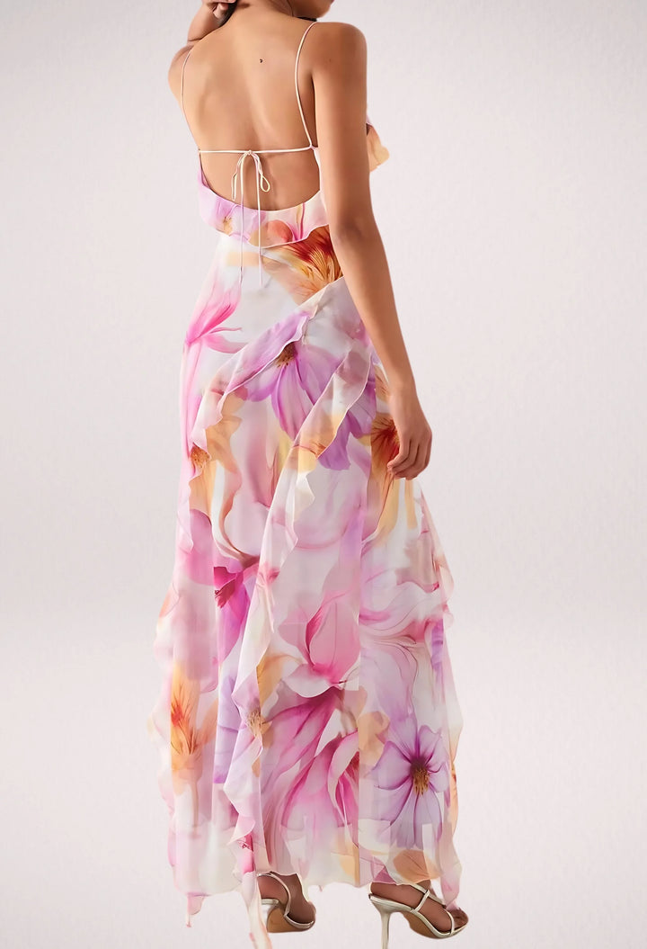 "Sleeveless floral maxi dress by Rihanna with ruffle trim, perfect for a casual chic look."