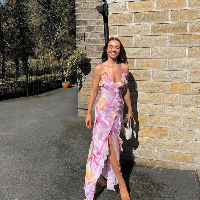 "Sleeveless floral maxi dress with ruffle trim, ideal for summer. Features a flowy design and vibrant print inspired by…