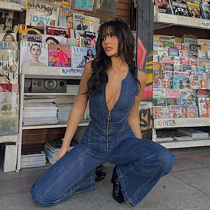 Sleeveless blue denim jumpsuit with zipper detail, perfect for a casual yet stylish look on warm days.