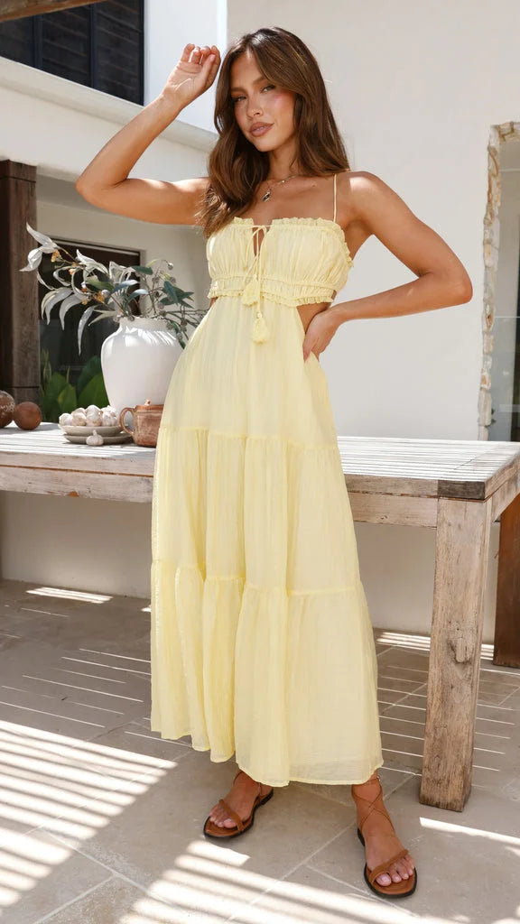 Women's tiered drawstring maxi dress in soft cotton blend with bohemian pattern and adjustable ties. Ideal for casual or…