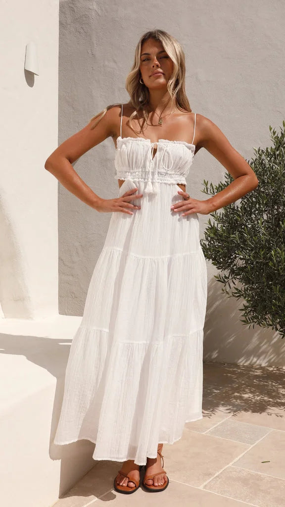 "White maxi dress with tiered design and drawstring waist for women, made of lightweight, flowy fabric."