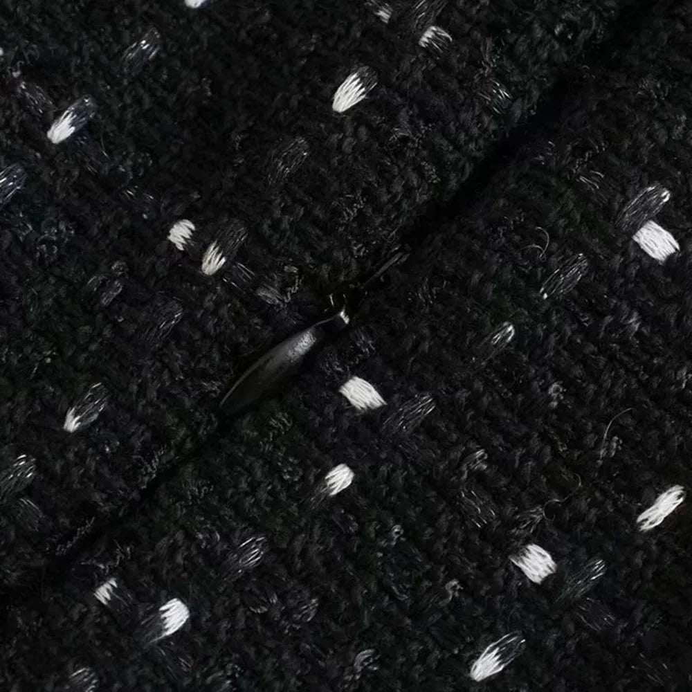 "Black dress with bead and pearl decorations, elegant design perfect for special occasions"