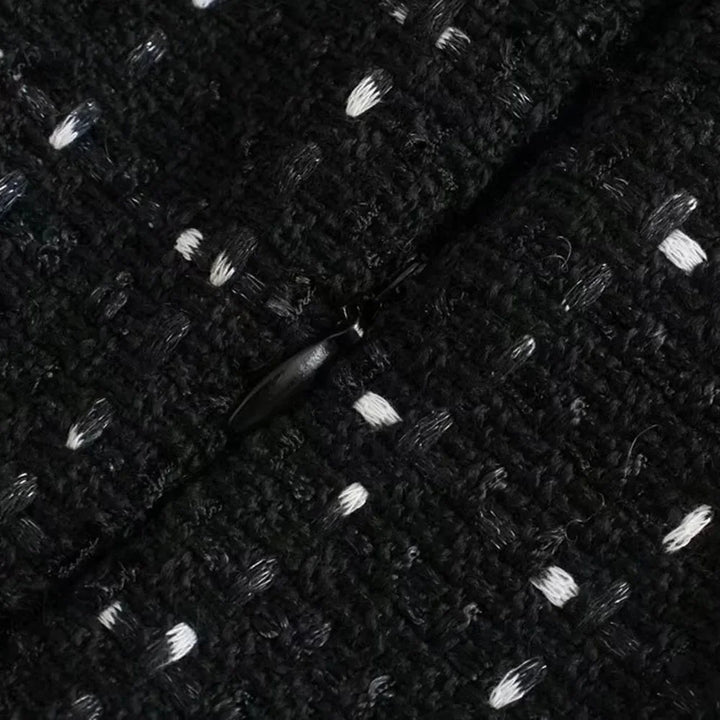"Black dress with bead and pearl decorations, elegant design perfect for special occasions"