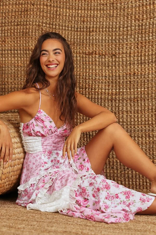 Women's tiered floral maxi dress in lightweight chiffon with adjustable spaghetti straps, perfect for a casual summer day…