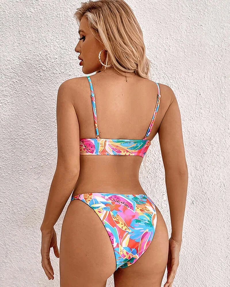 Tropical print bikini with tie front featuring a vibrant design, perfect for lounging by the pool or soaking up the sun at…