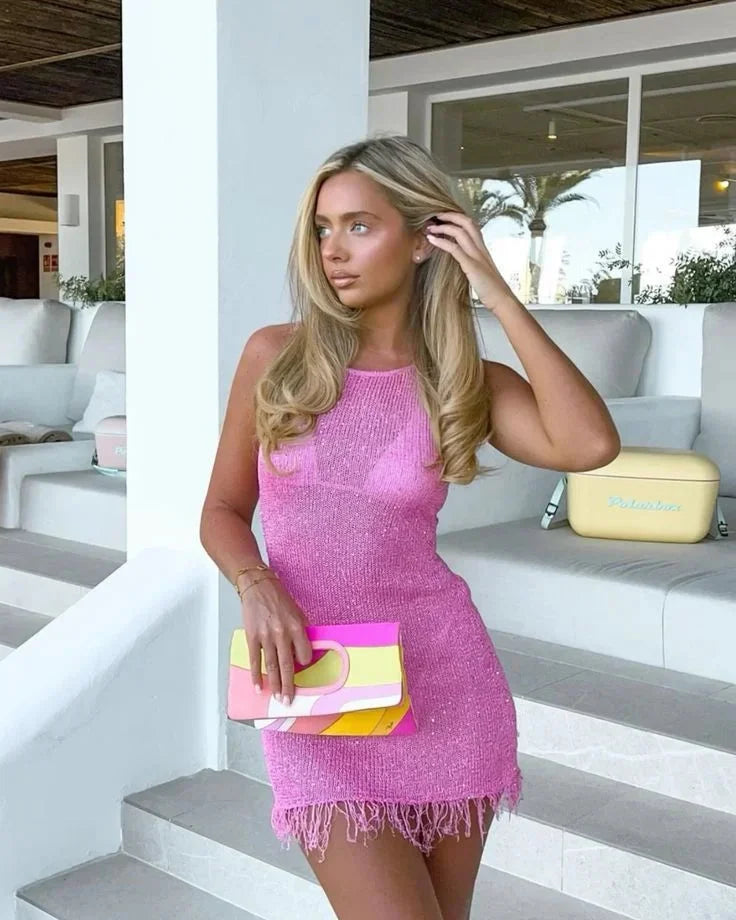 Sleeveless rose red mini dress with fringes, perfect for a fun and flirty look.