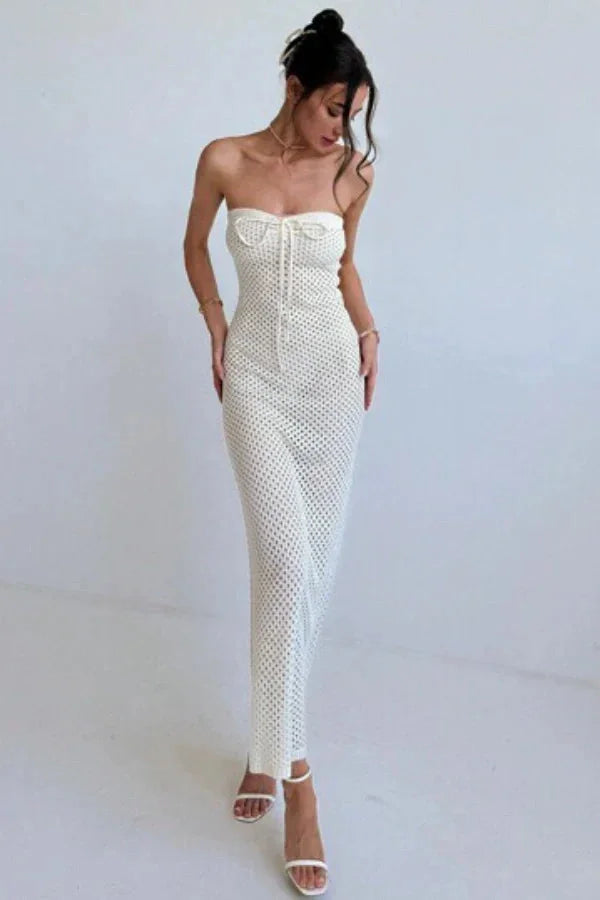 Strapless cream crochet maxi dress with unique floral pattern and elegant design perfect for special occasions.