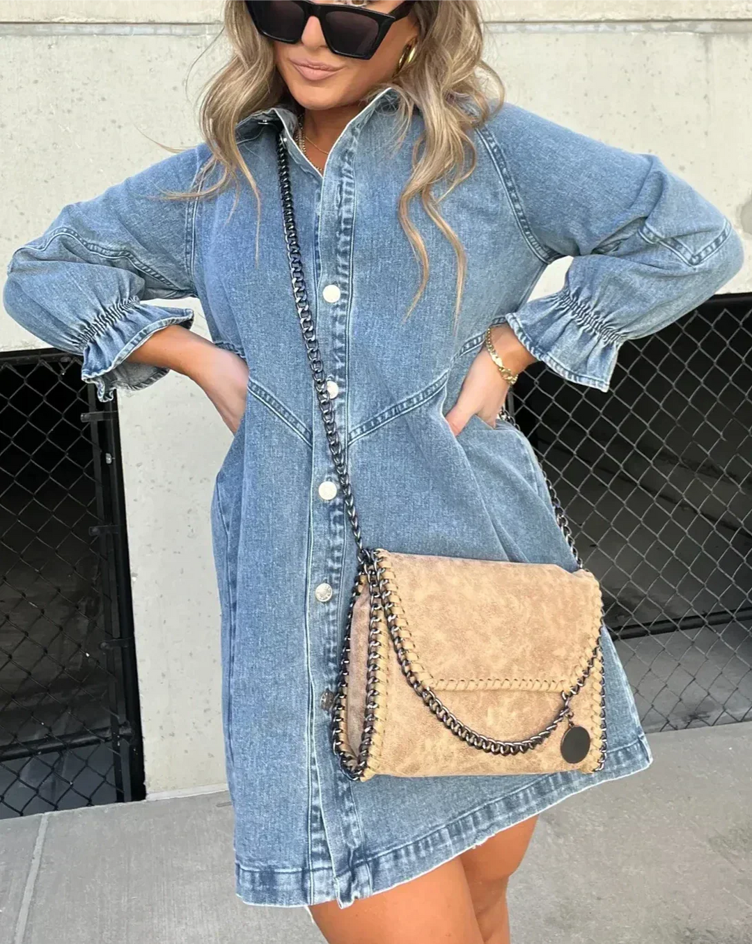 Blue mini shirt dress with button closure, made from high-quality cotton blend fabric. Features a flattering design for a…