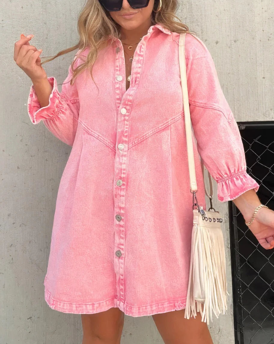 Pink mini shirt dress with button closure made of soft cotton blend. Features a classic collar and short sleeves for a…