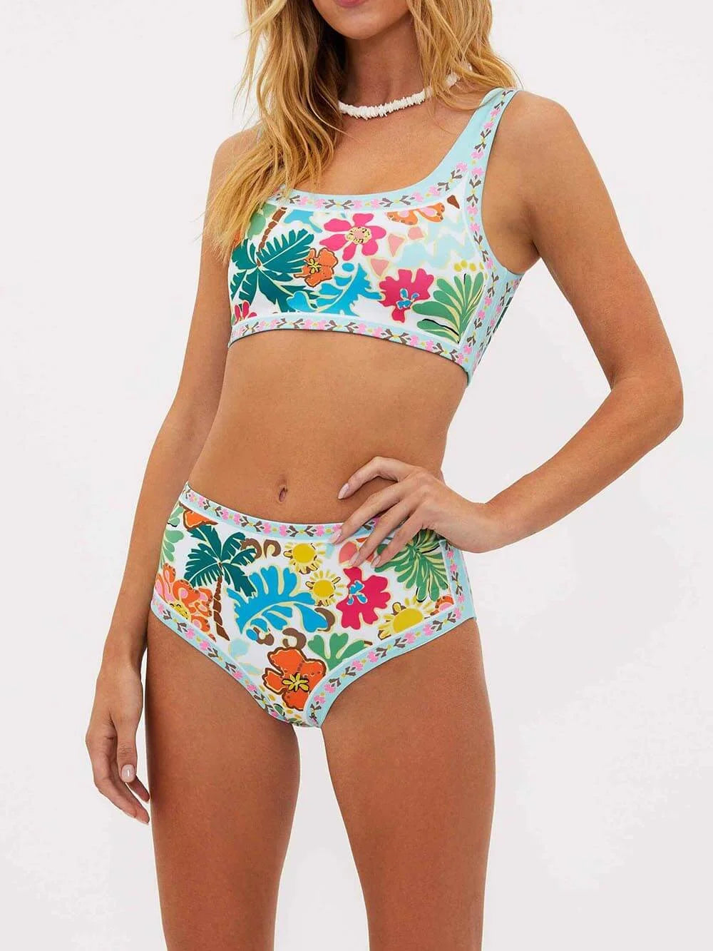 Floral high-waisted bikini set in Rue design with vibrant colors and intricate floral print, ideal for a stylish beach look.