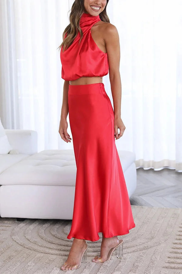 Two-piece satin set in starlight purple with flowing skirt and crop top with spaghetti straps.