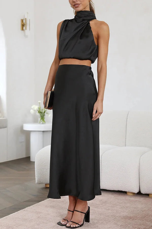 Black satin top and skirt set by Ruthann featuring a flowing design.