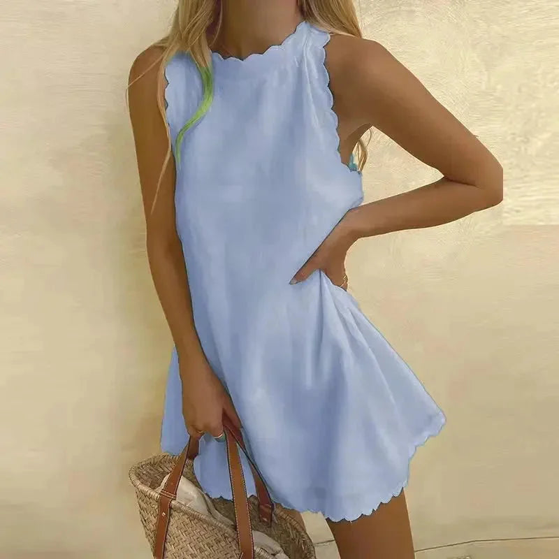 Light blue sleeveless dress with scalloped hem, perfect for summer. Made with soft and breathable fabric, a versatile…
