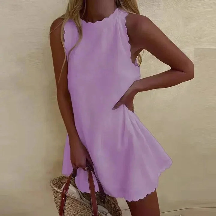 Sleeveless dress in light purple with scalloped hem, made from soft and breathable fabric perfect for sunny days.