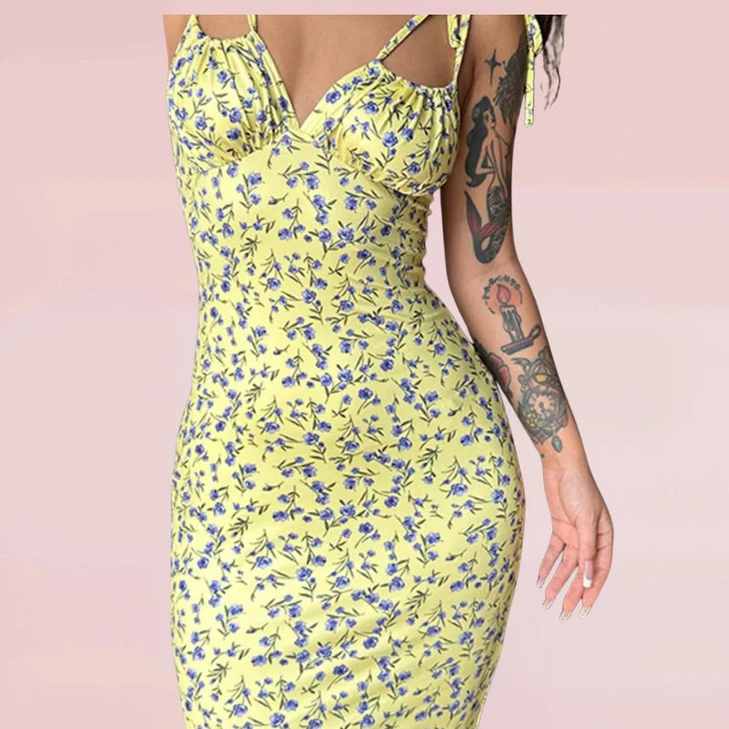 Sleeveless floral maxi dress in soft cotton blend with vibrant floral pattern and relaxed fit perfect for summer days.