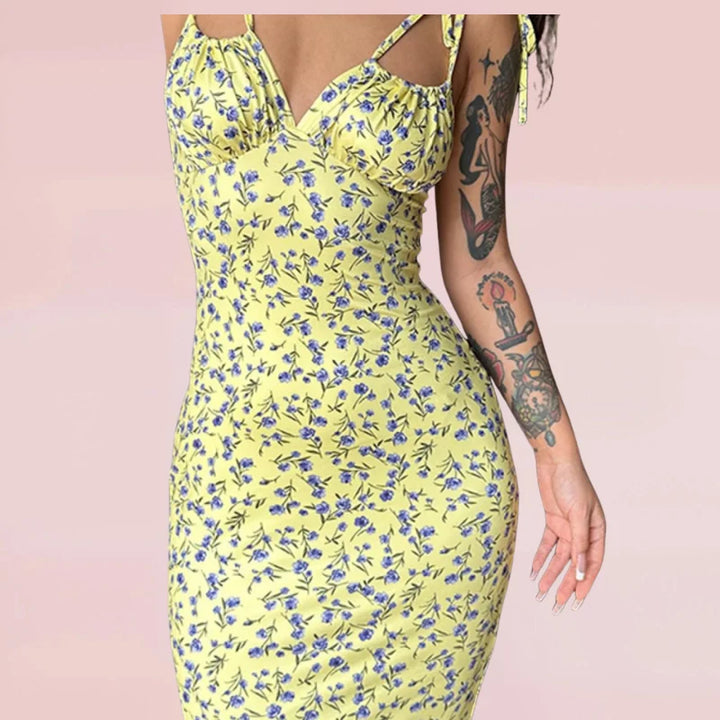 Sleeveless floral maxi dress in soft cotton blend with vibrant floral pattern and relaxed fit perfect for summer days.