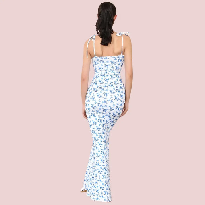 "Sleeveless floral maxi dress with a vibrant design featuring a flowy silhouette and breathable fabric."