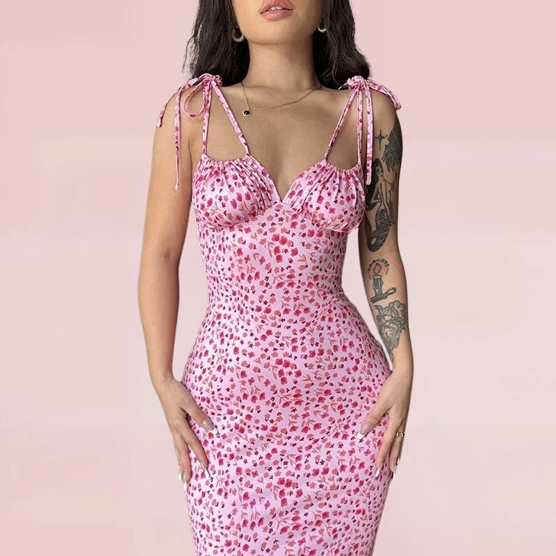 Sleeveless floral maxi dress in soft cotton blend, featuring a vibrant floral pattern on a black background. Perfect for…